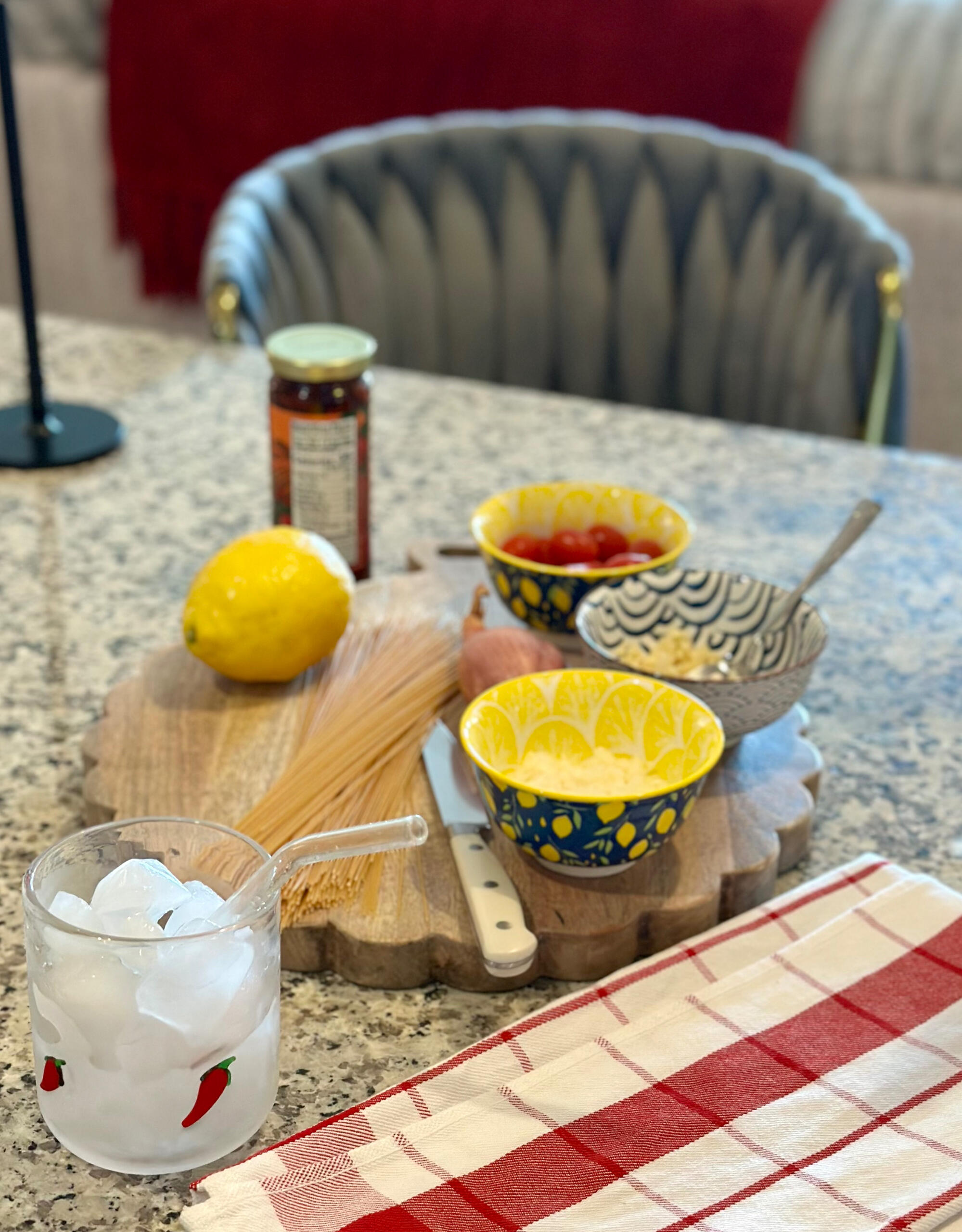 Anti-inflammatory ingredients on kitchen counter Bowls with lemon, pasta, and ingredients for anti-inflammatory recipes